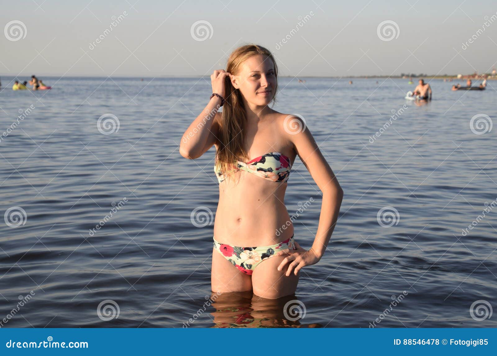 A Young Teenage Girl In A Bikini Standing At The Waters Edge. Stock Photo,  Picture and Royalty Free Image. Image 42149309.