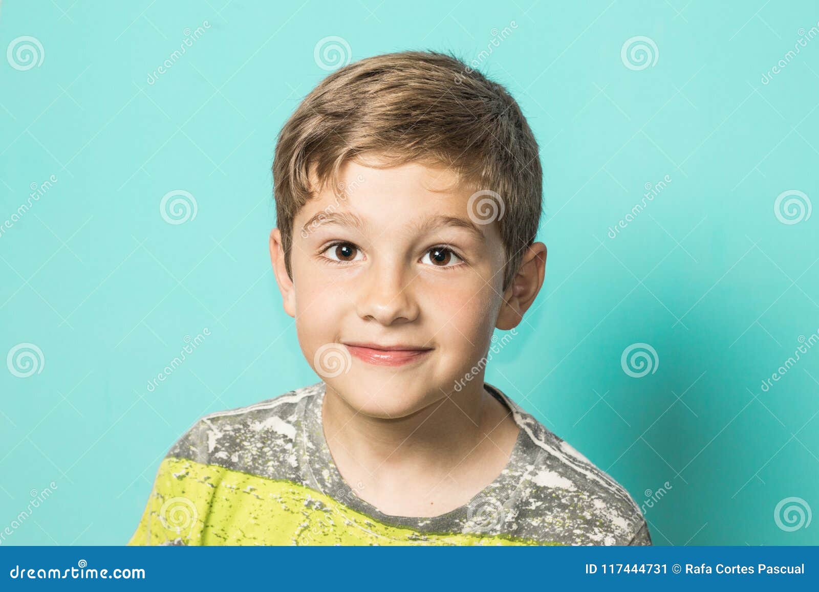Blond Kid Looking at the Camera and Smiling. Child with Expression in the Happy Face Stock Image