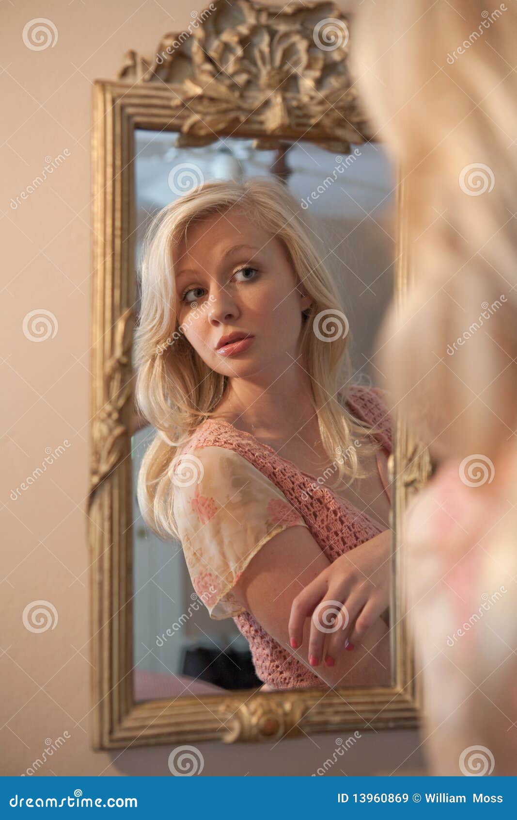 Blond Woman Gazing At Self In Mirror Royalty Free Stock Images Image