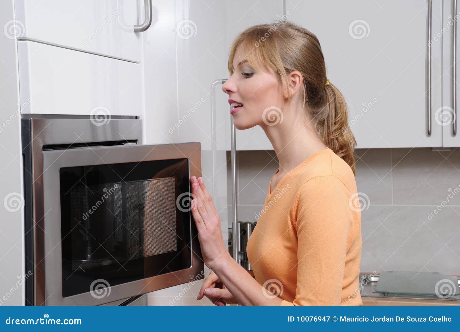 Free Photos - In This Stock Photo, A Young Woman With A Melancholic  Expression Is Standing Next To An Old, Dusty Microwave Oven In A Dimly Lit  Room. The Woman Seems To