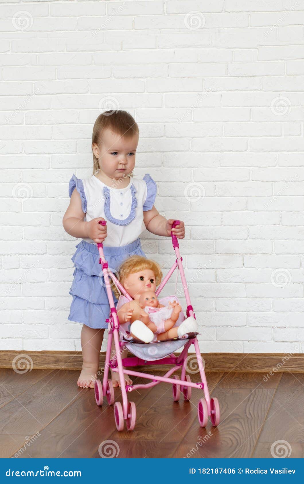 Baby Girl Test Doll Stroller. Funny Cute Baby Girl Riding in a Toy ...