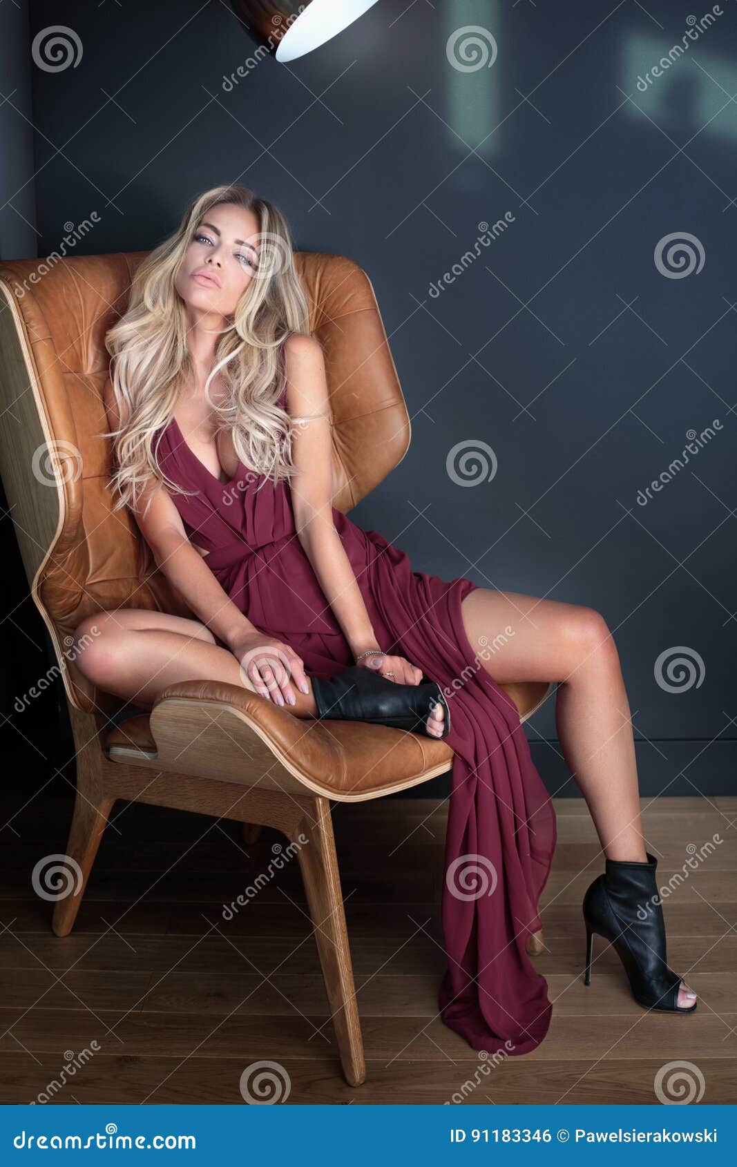 blonde beautiful woman wearing fashionable dress.