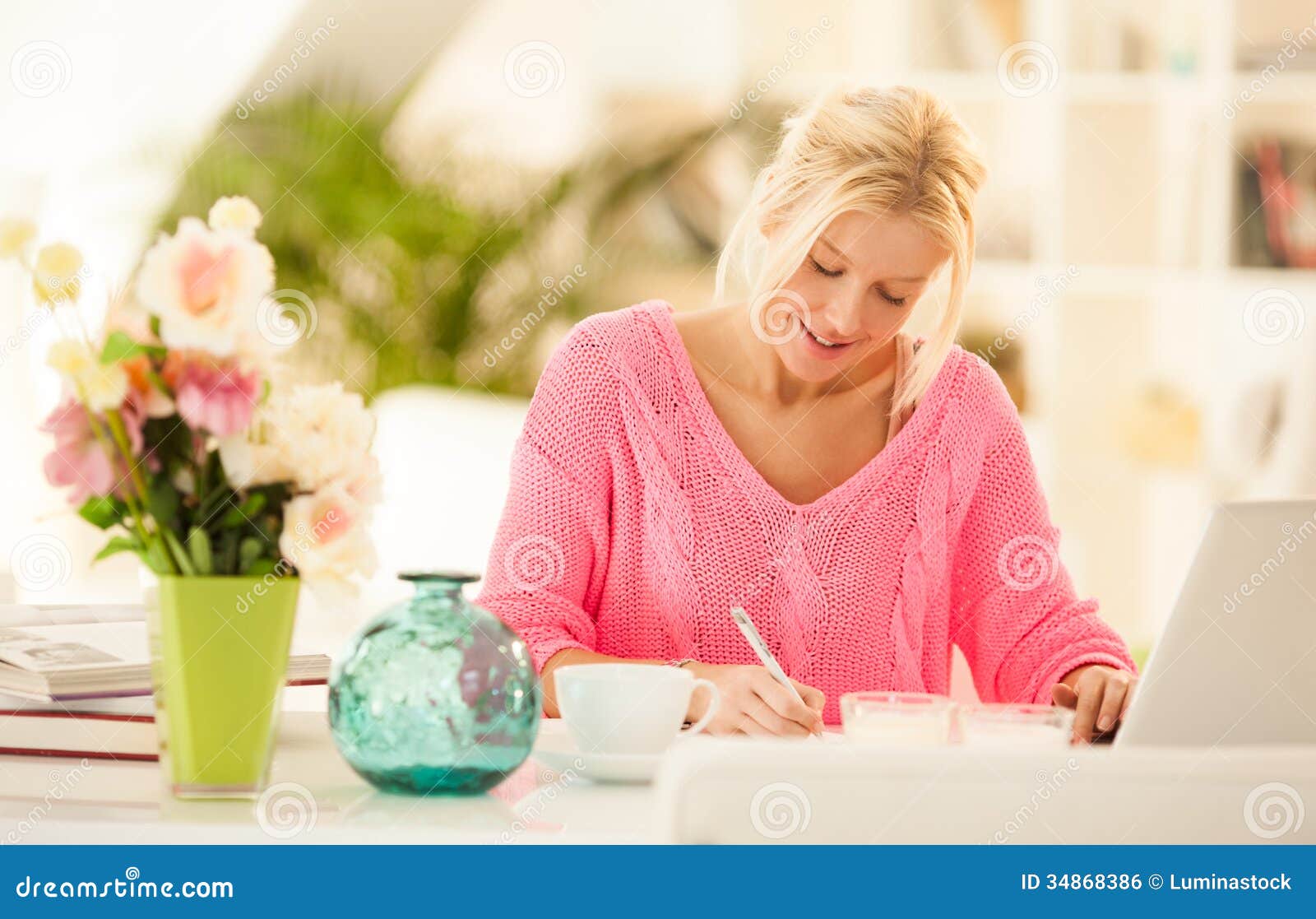 Blonde woman writing at desk - wide 3