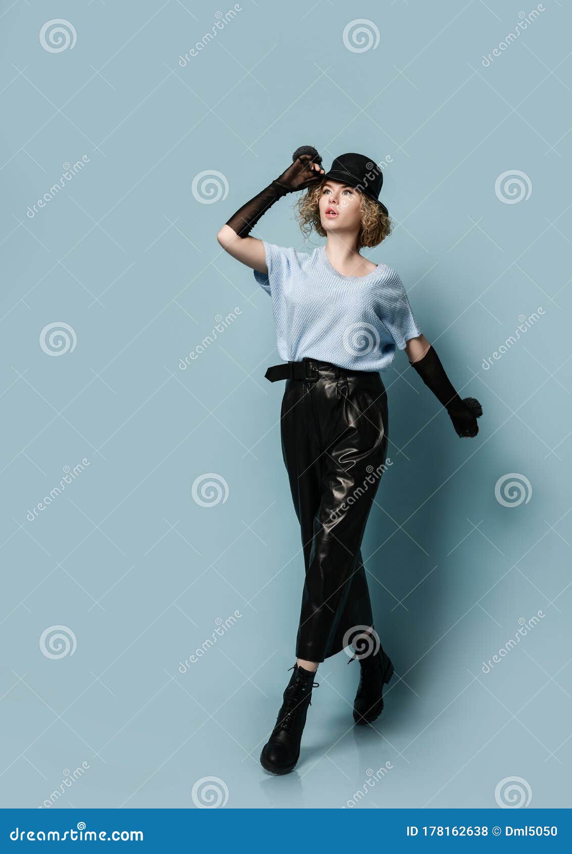 Blonde Curly Woman in Stylish Black Leather Pants, Gloves, Hat, Massive ...