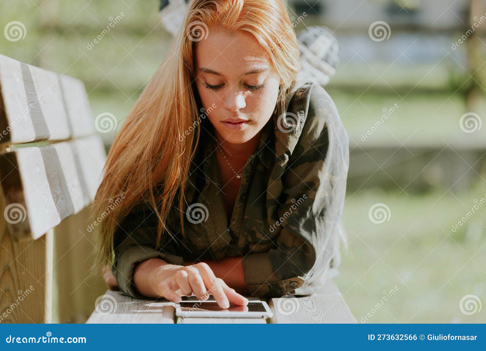 blonde girl, casual-sporty attire, digital tablet