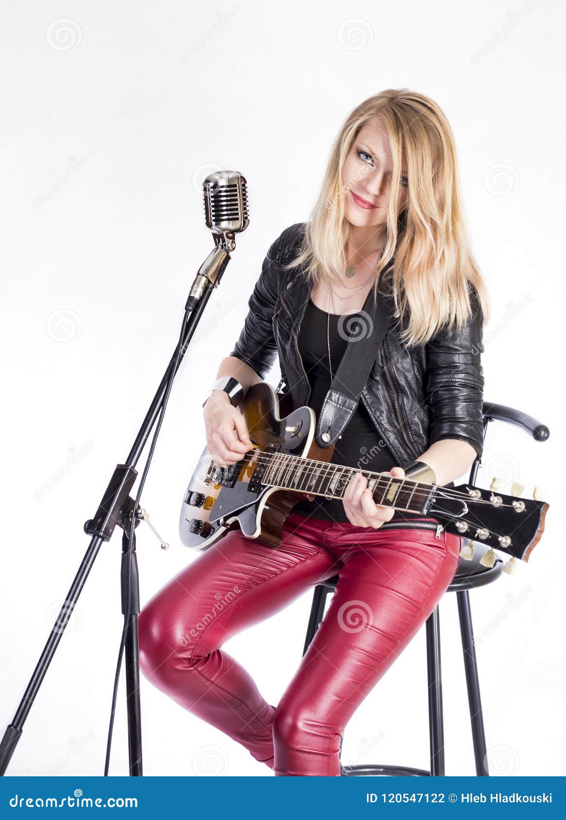 Blonde Girl Guitarist With Electric Guitar Learns Plays Song Sits