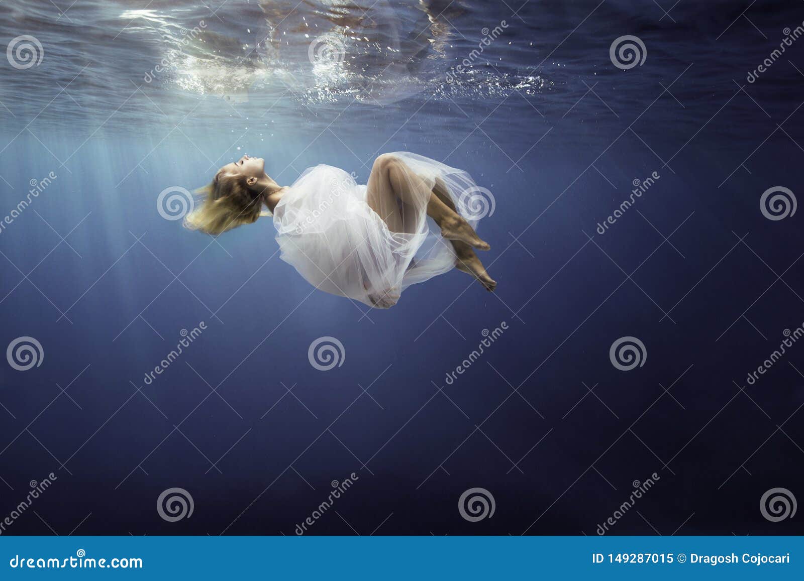 Blonde Girl Wrapped In Fine White Cloth, Sank In Blue Deep Water Of ...