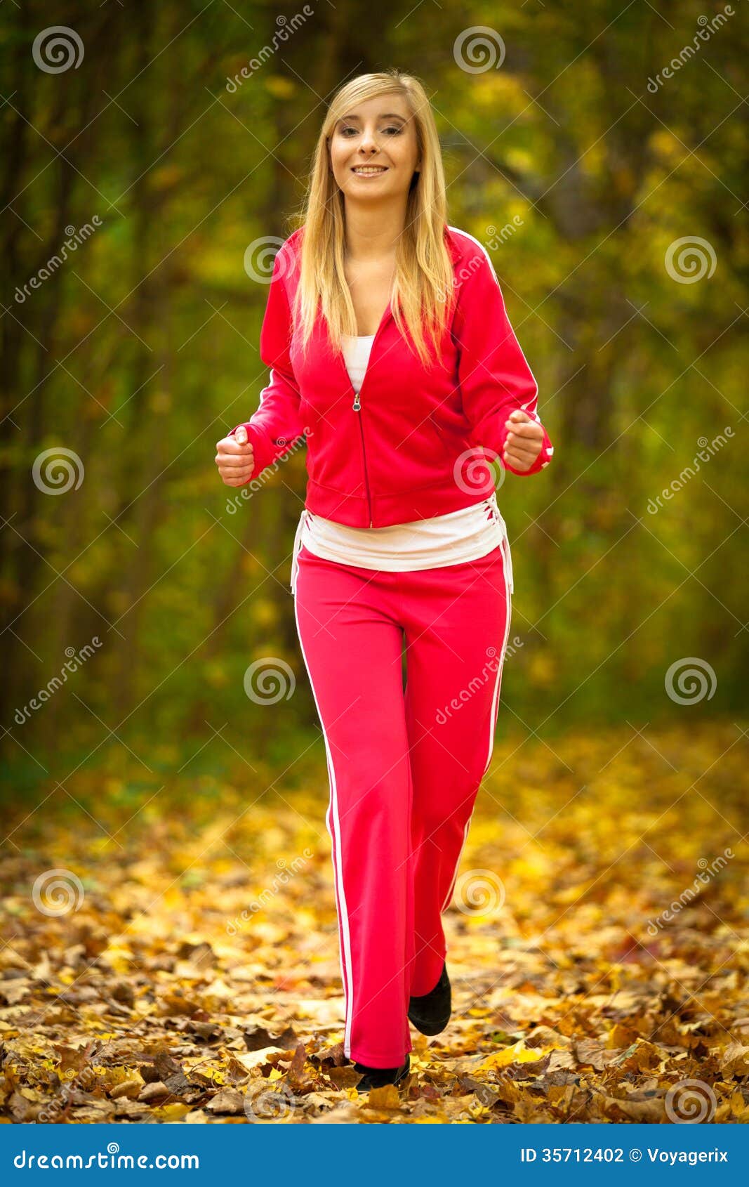 Blonde Girl Young Woman Running Jogging In Autumn Fall Forest Park ...