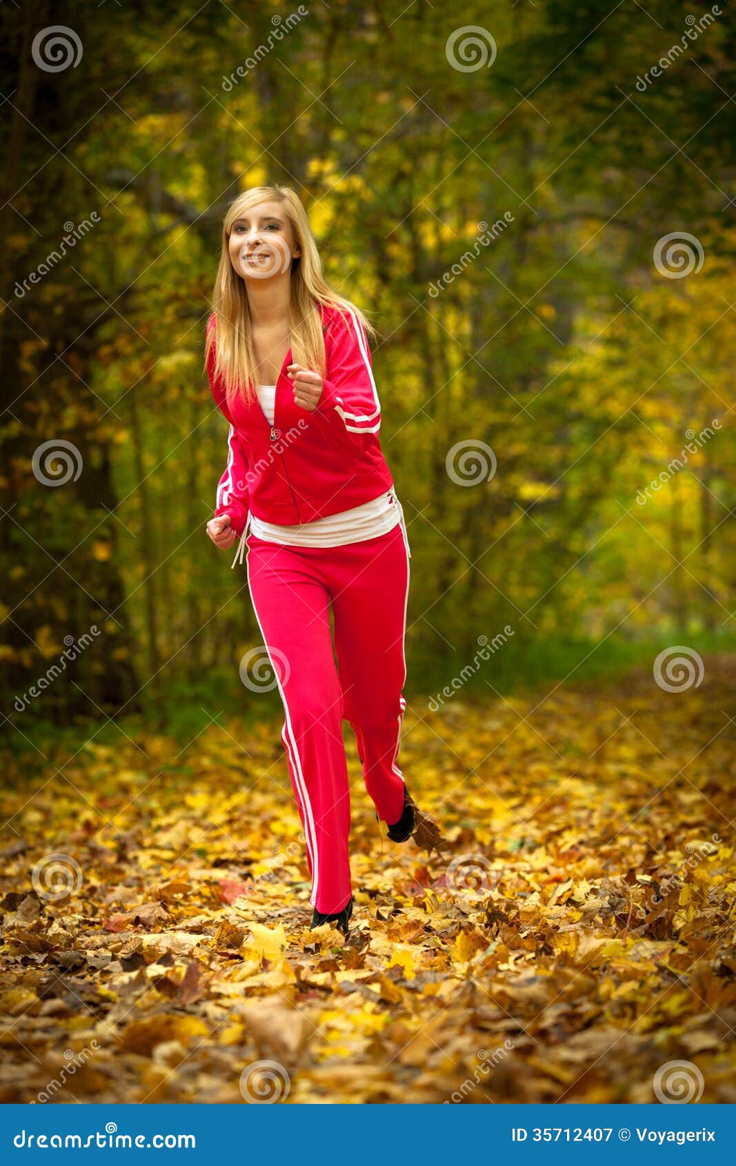 Blonde Girl Young Woman Running Jogging in Autumn Fall Forest Park ...