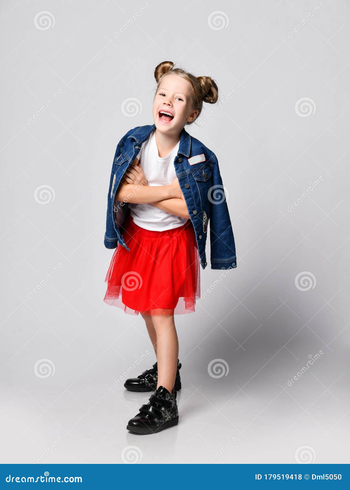 Young happy cute teenage girl in jeans denim jacket and white Tshirt  sitting on chair against grey textured wall background Casual daily  lifestyle Stock Photo  Alamy