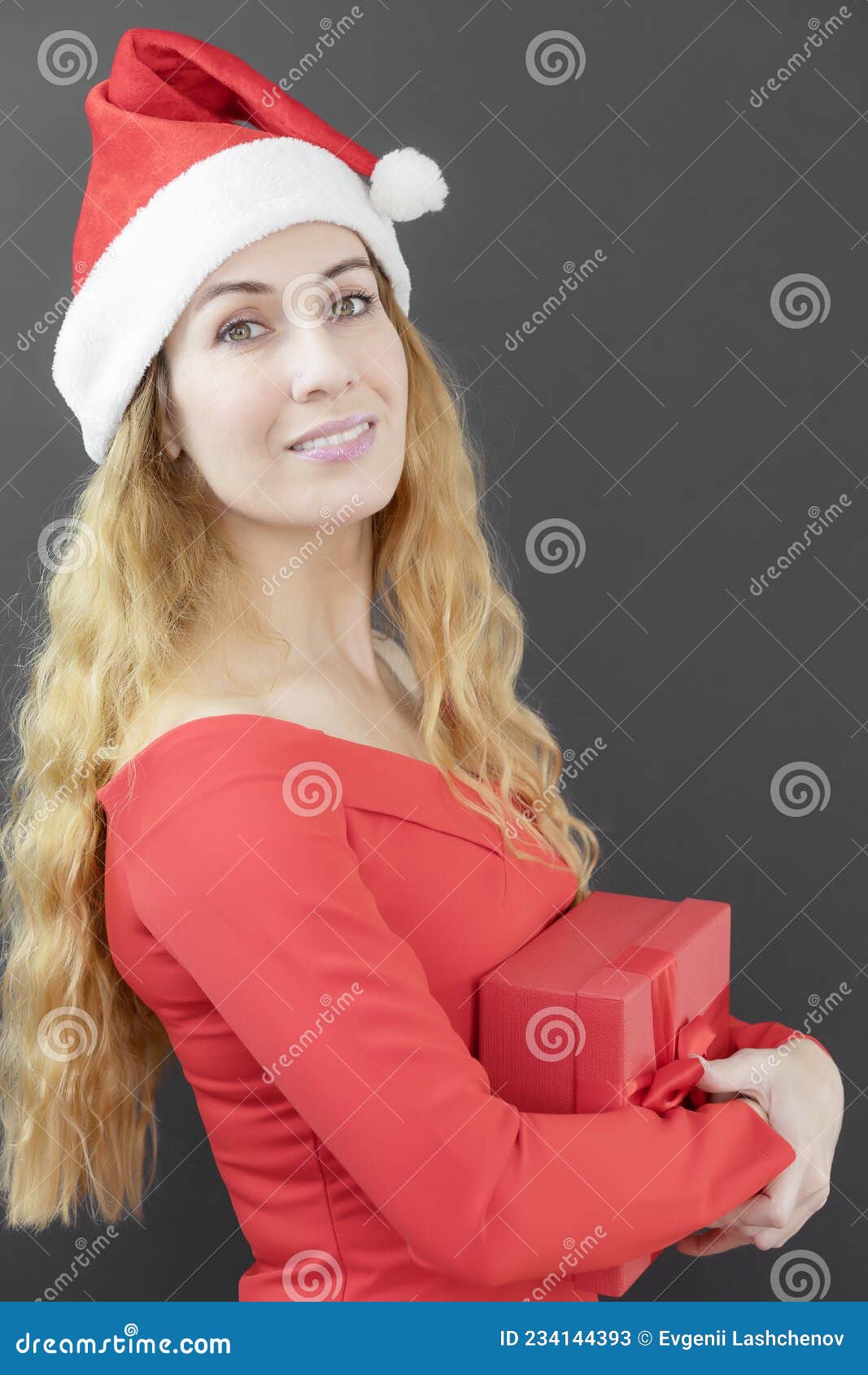 Smiling Girl In A Spnt Hat Lady Santa With Red Box Christmas Present Christmas Poster Stock