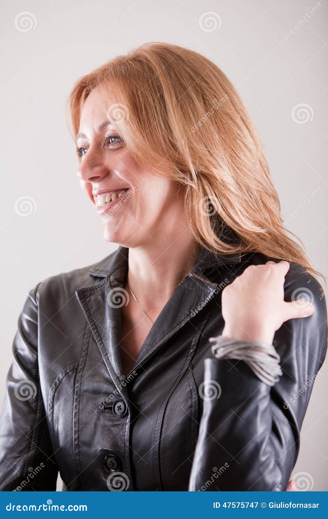 Blonde Mature Woman Smiling In Black Leather Stock Image Image Of Pensive Woman 47575747