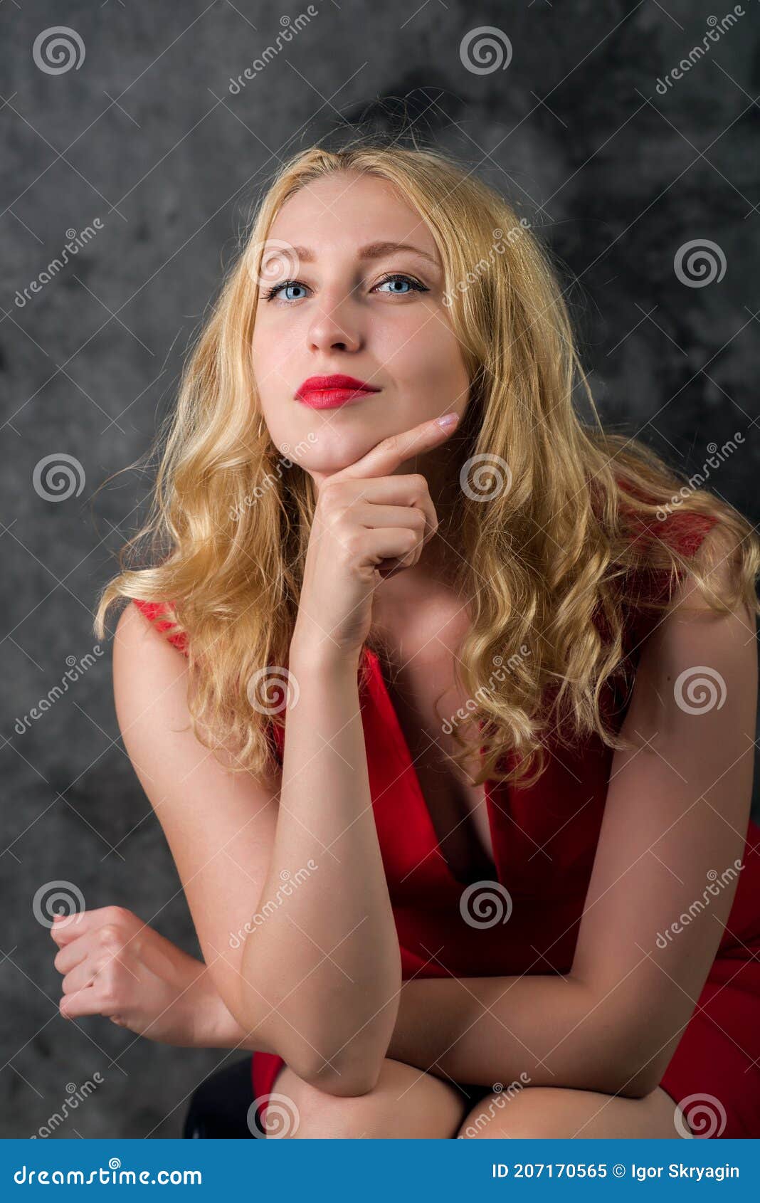 Blonde In A Red Dress Looks Into The Camera Stock Image Image Of Camera Female 207170565