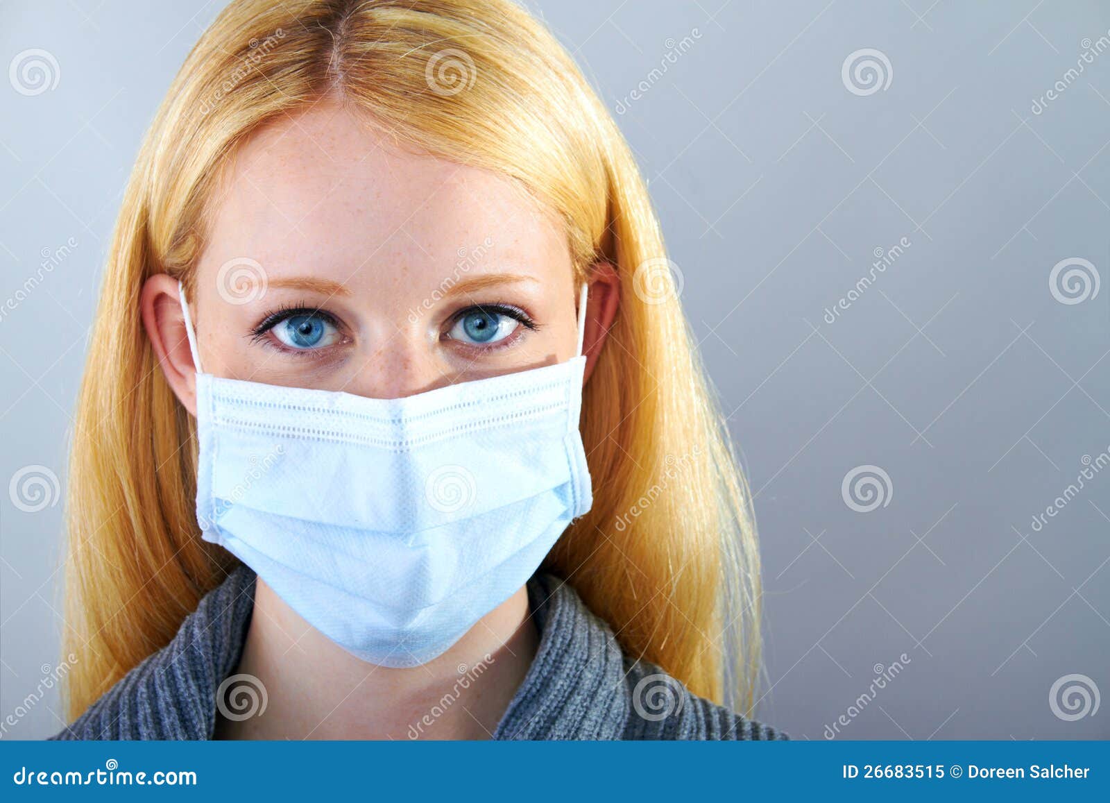 blonde serious woman with surgical mask