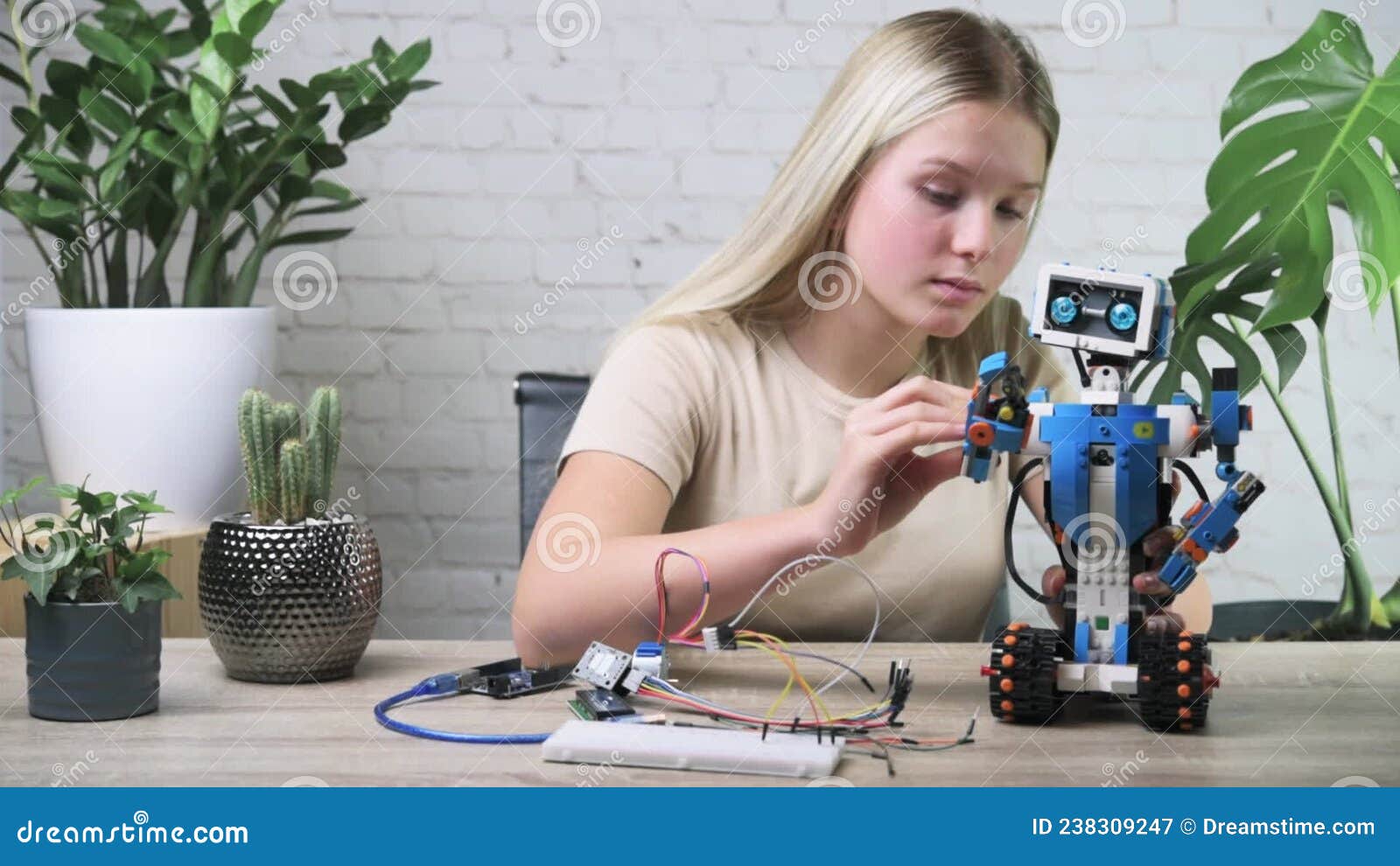 https://thumbs.dreamstime.com/z/blonde-teen-girl-building-programming-robot-studying-robotics-engineering-coding-stem-courses-children-238309247.jpg