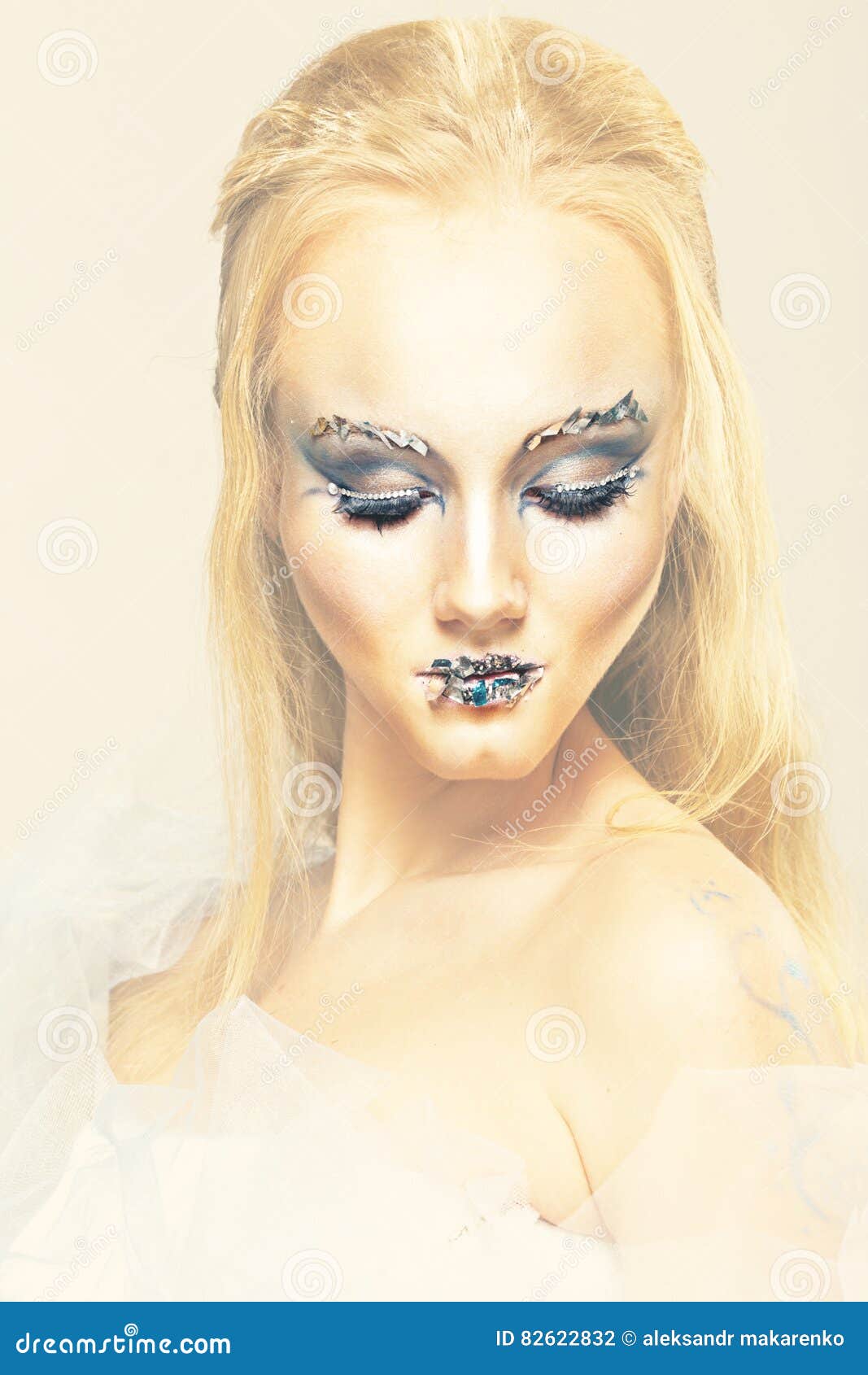 Blonde In A White Dress With Blue Makeup The Snow Queen Stock