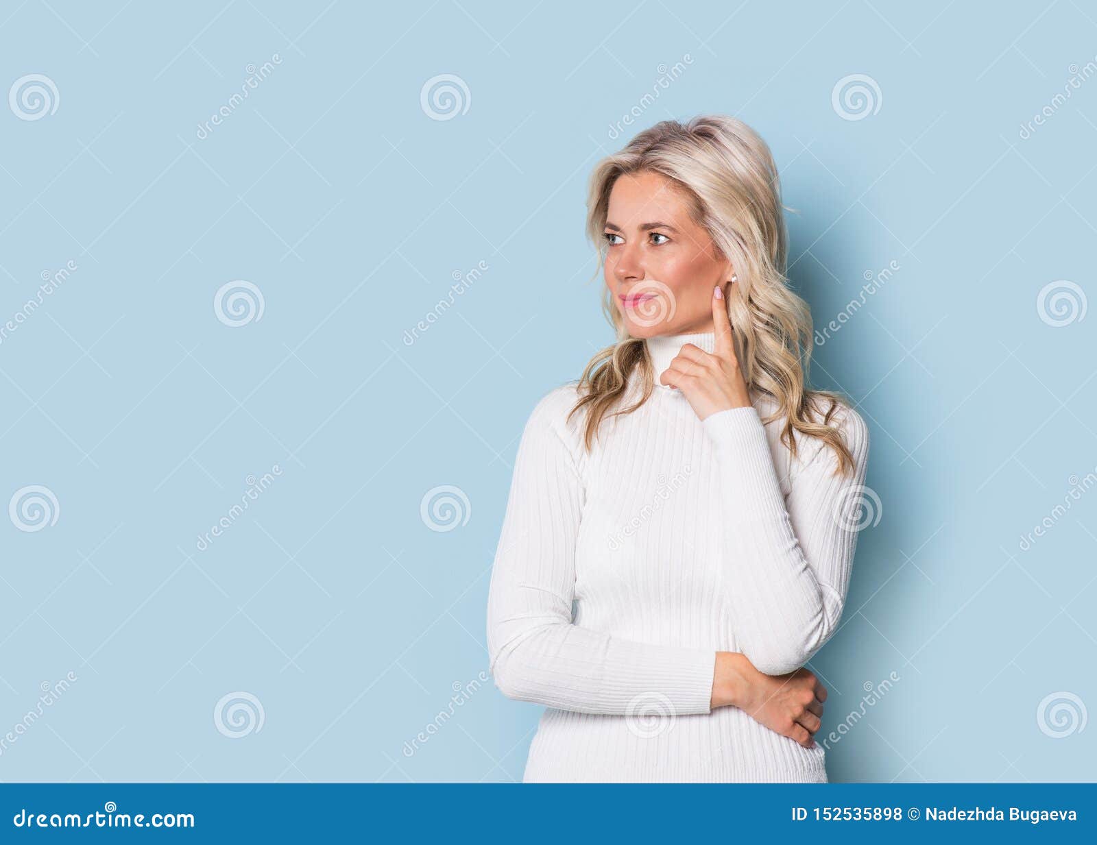 blonde woman adult attractive beautiful smiling portrait, cauasian and scandinavian girl on blue background