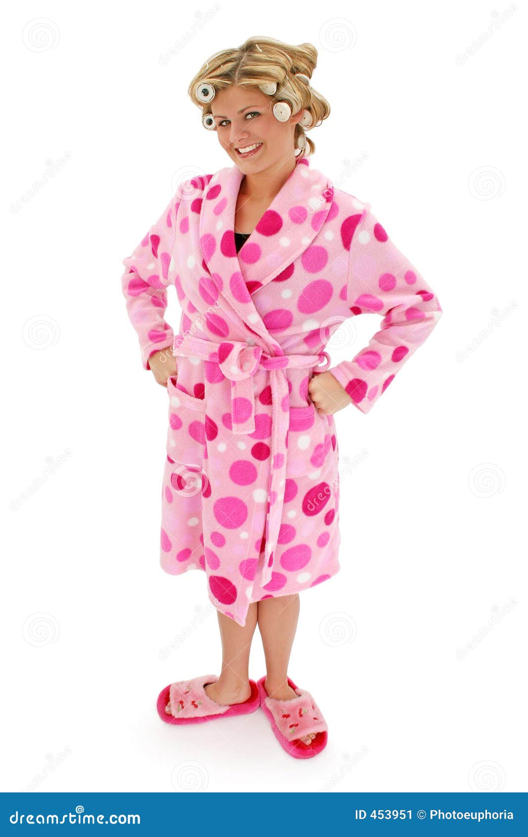 Blonde Woman in Bathrobe. Beautiful blonde woman in pink polka dot bathrobe and hair rollers. Shot with a Canon 20D.