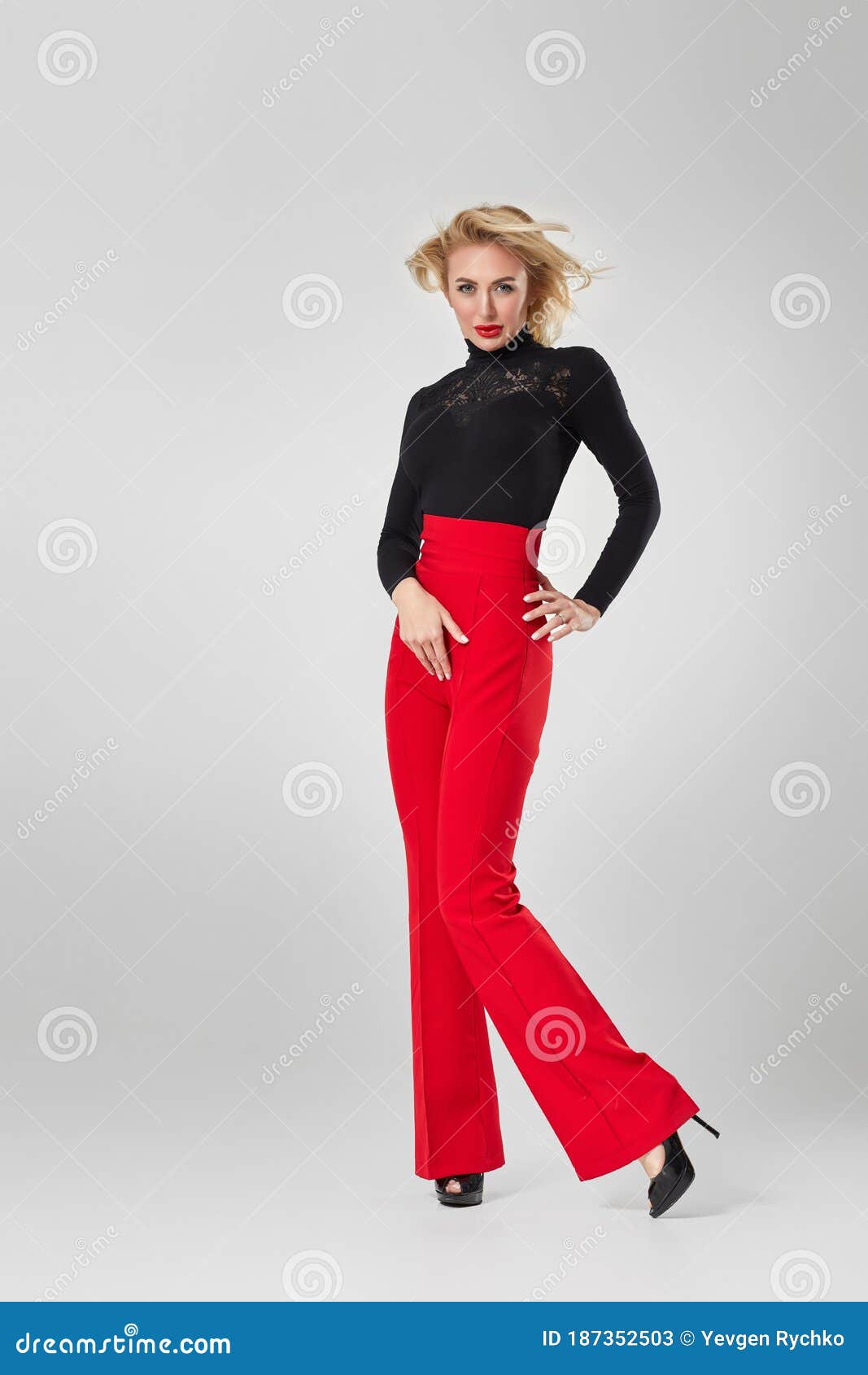 A Man Wearing a Black Shirt and Red Pants  Free Stock Photo