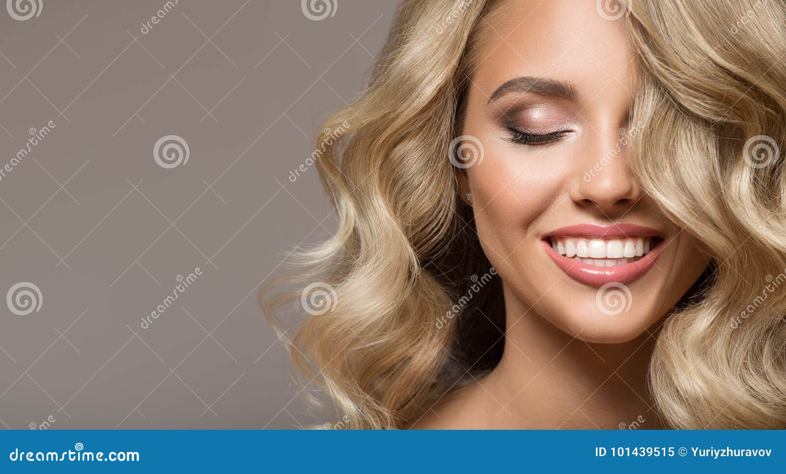 blonde woman with curly beautiful hair smiling