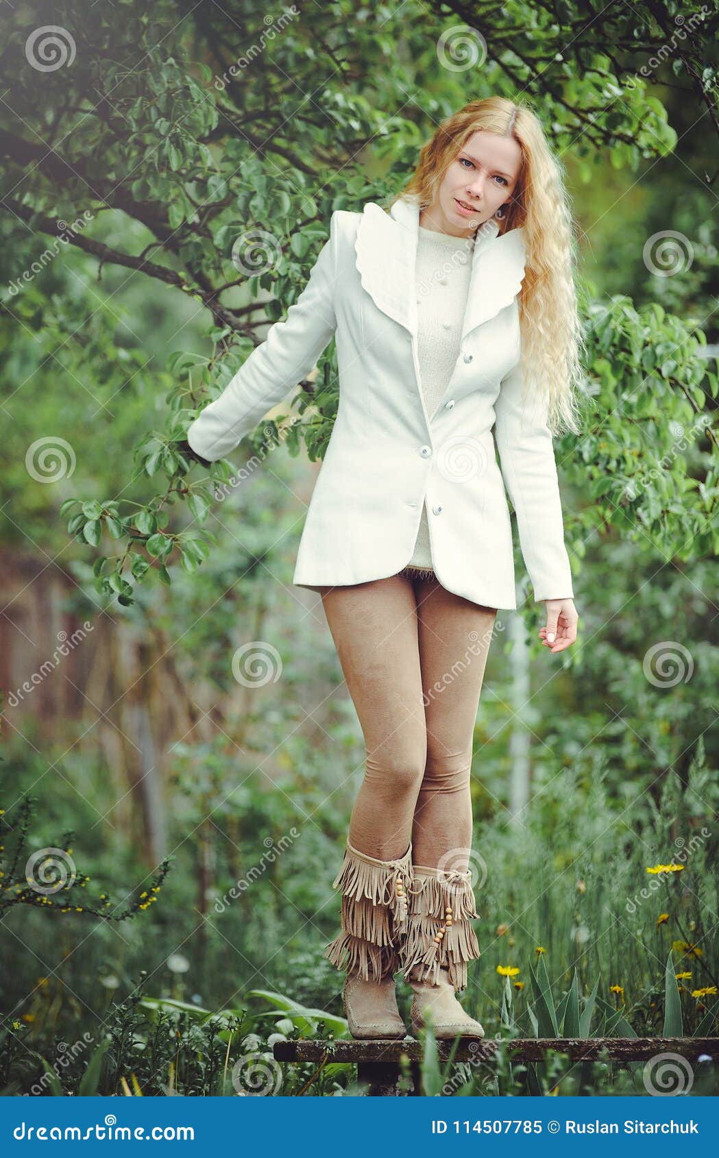 Blonde Woman on a Green Background in White Clothes, Cool Summer, Shy ...