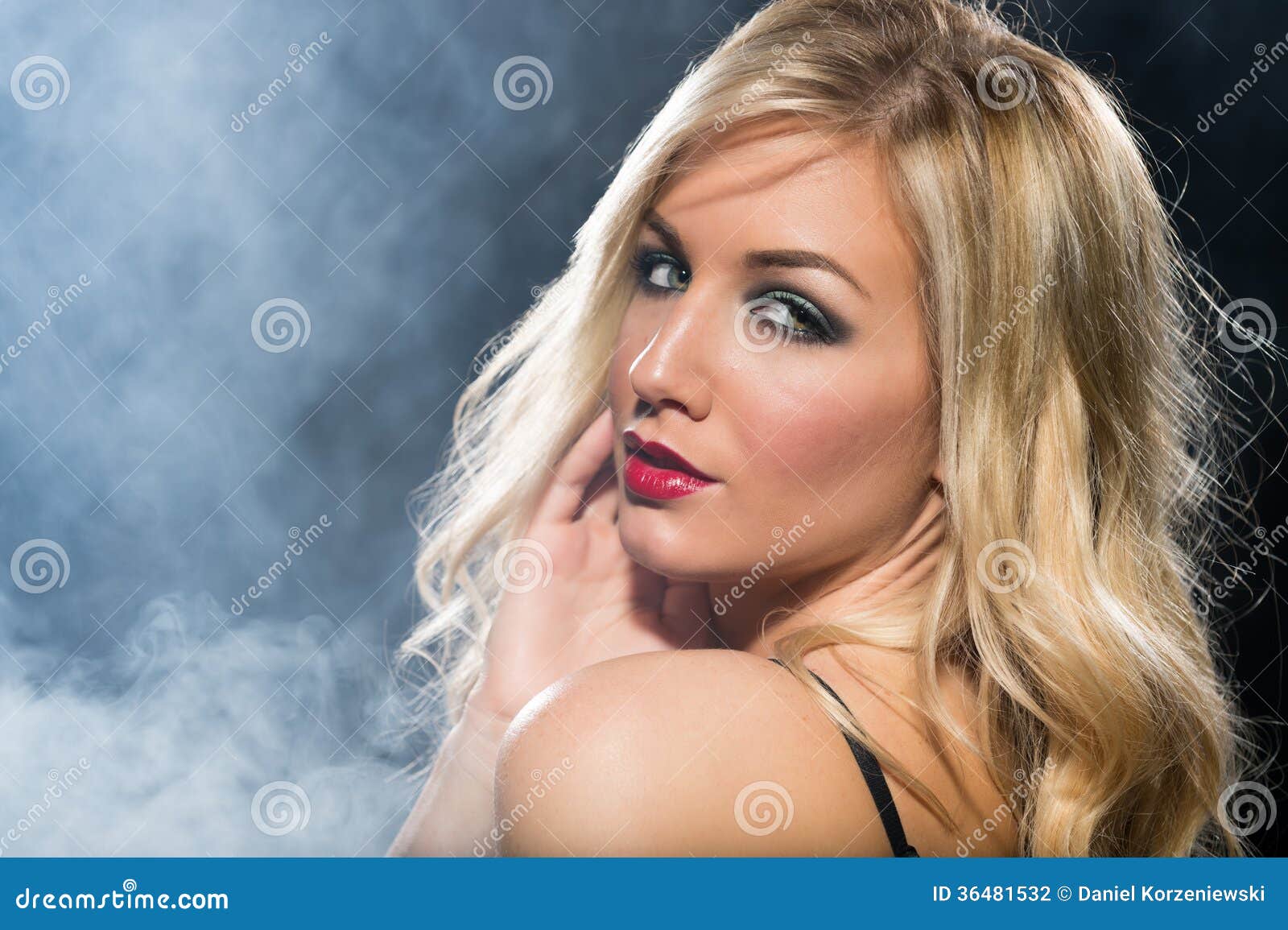 Blonde woman with long hair looking over her shoulder - wide 2