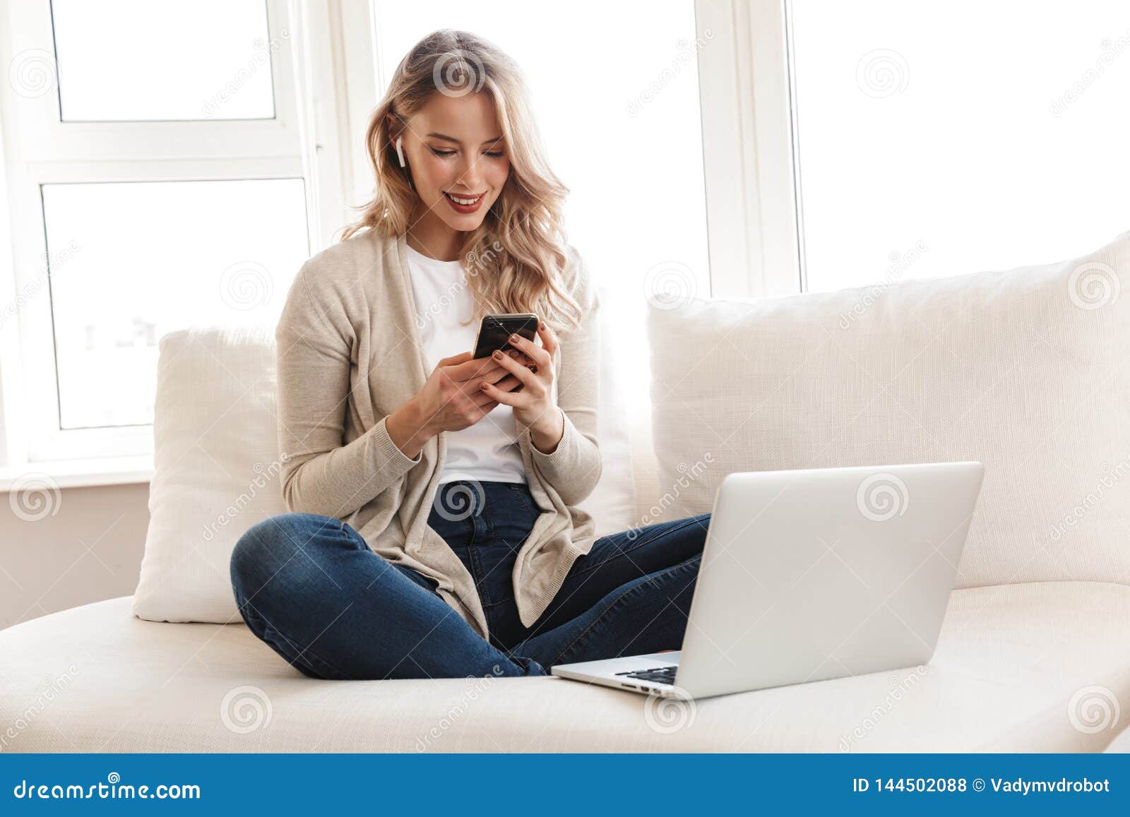 Blonde Woman Posing Sitting Indoors at Home Using Laptop Computer and ...