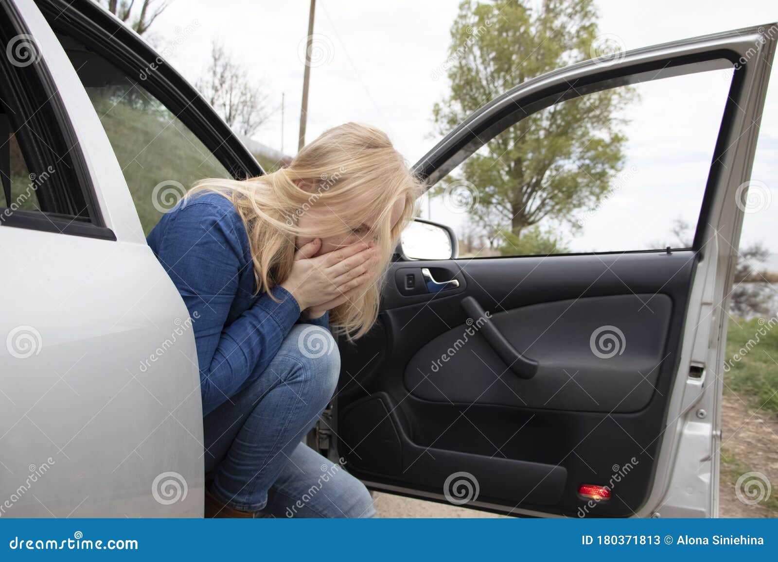 nausea during a car trip. a blonde woman suffers from kinetosis. the concept of motion sickness in diseases of the transport and