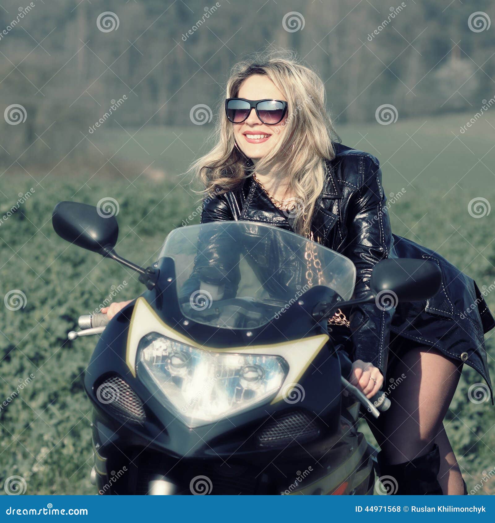 Blonde Woman in Sunglasses on a Sports Motorcycle Stock Photo - Image ...