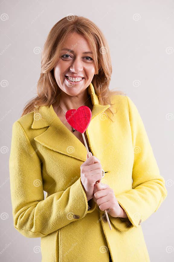 Blonde Woman Touches Heart Symbolizing Mature Love Stock Image Image Of Woman Embrace 288566881