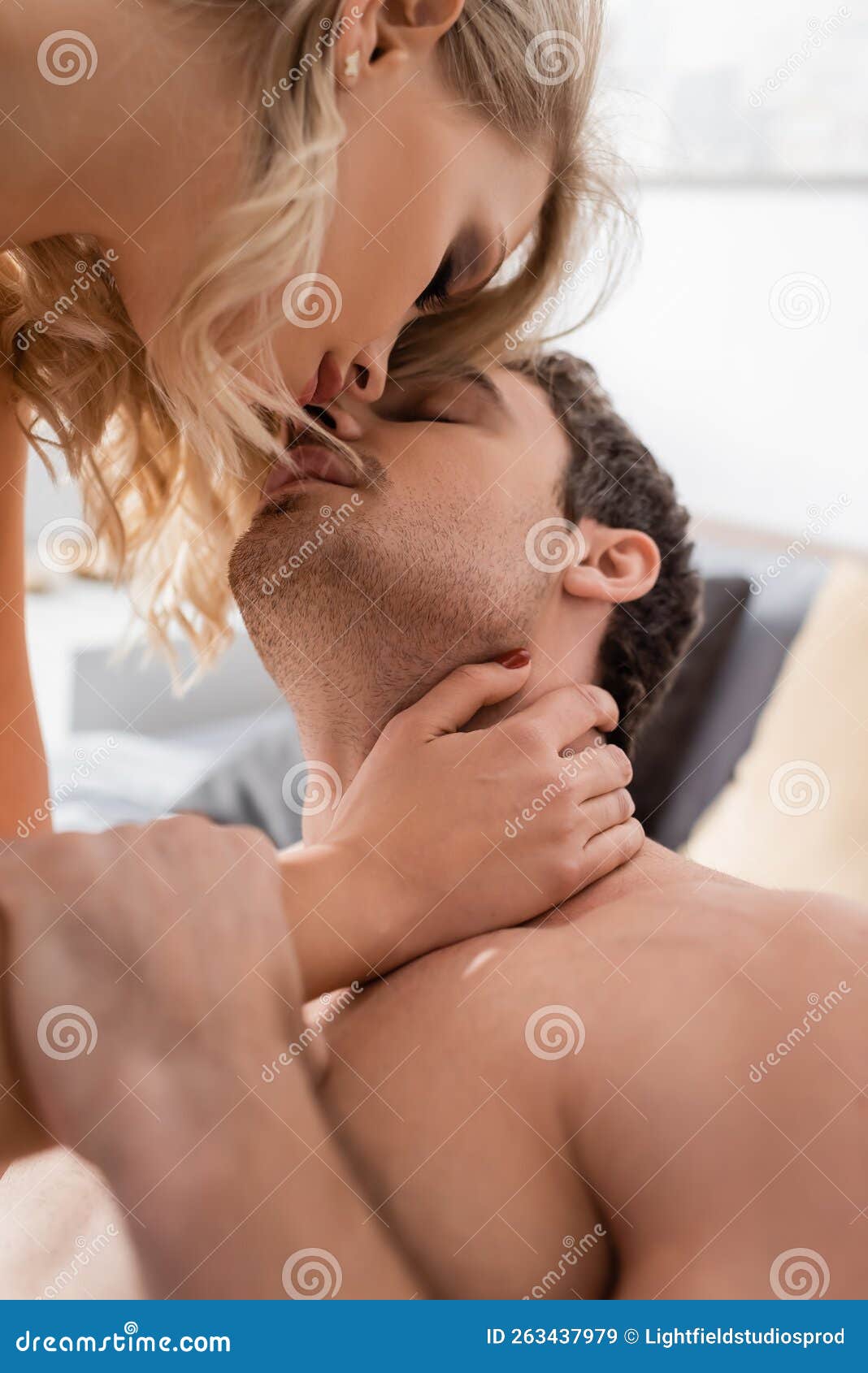 Blonde Woman Kissing and Touching Neck Stock Image