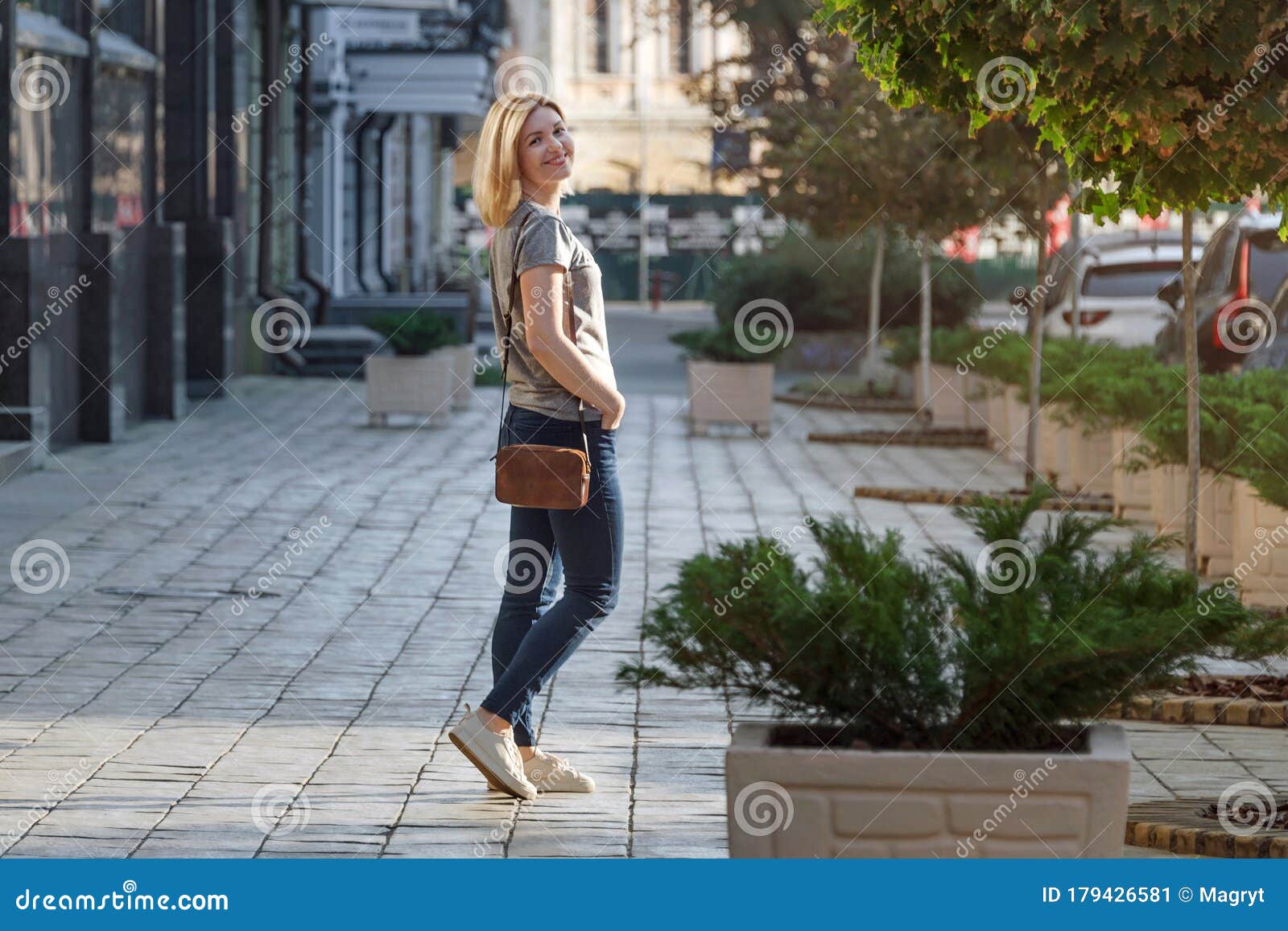 Blonde Young Woman Walking and Posing on Sunny Street. Woman Walking in ...