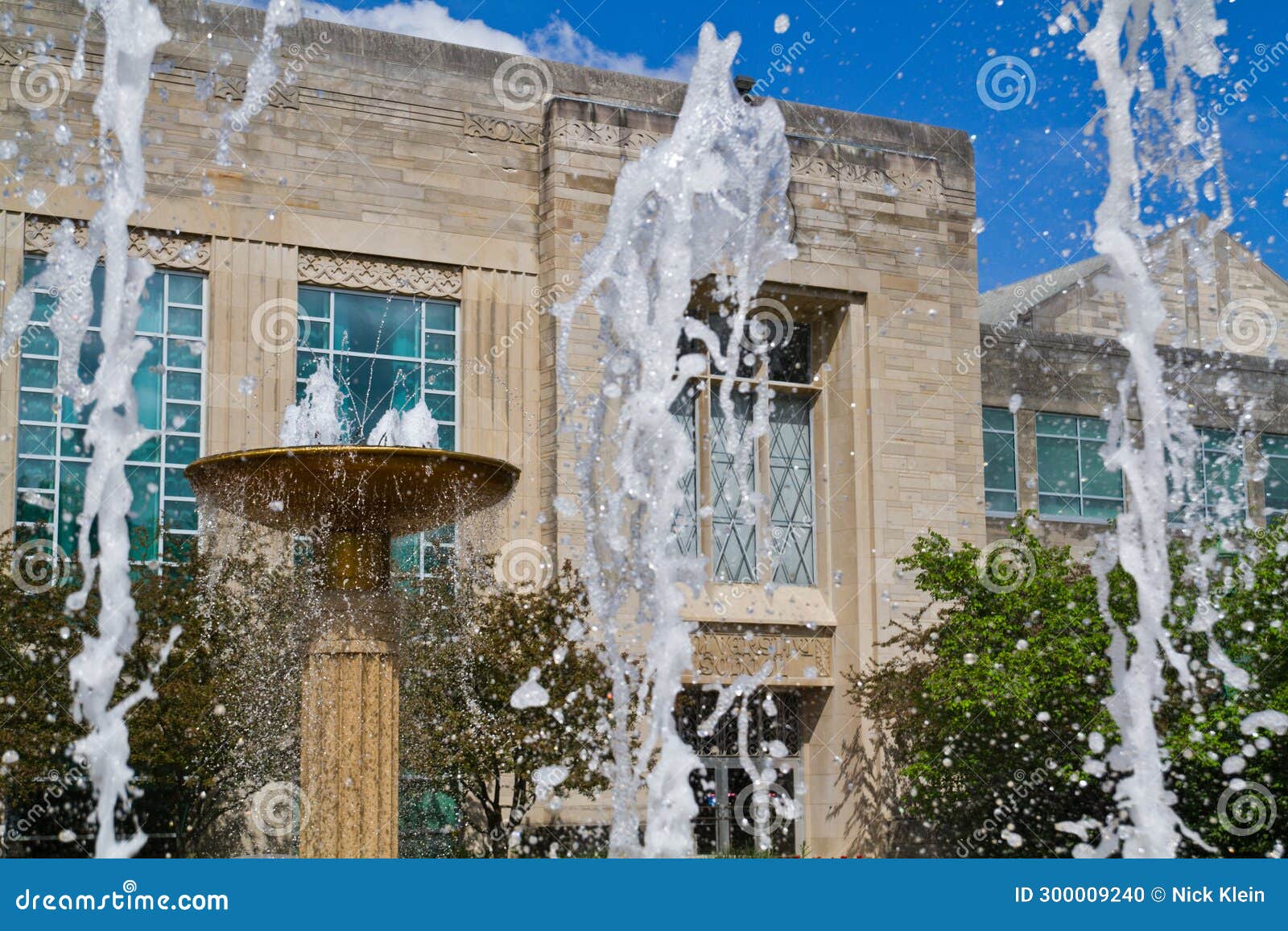 Bloomington Classic Architecture and Vibrant Water Fountain in Daylight