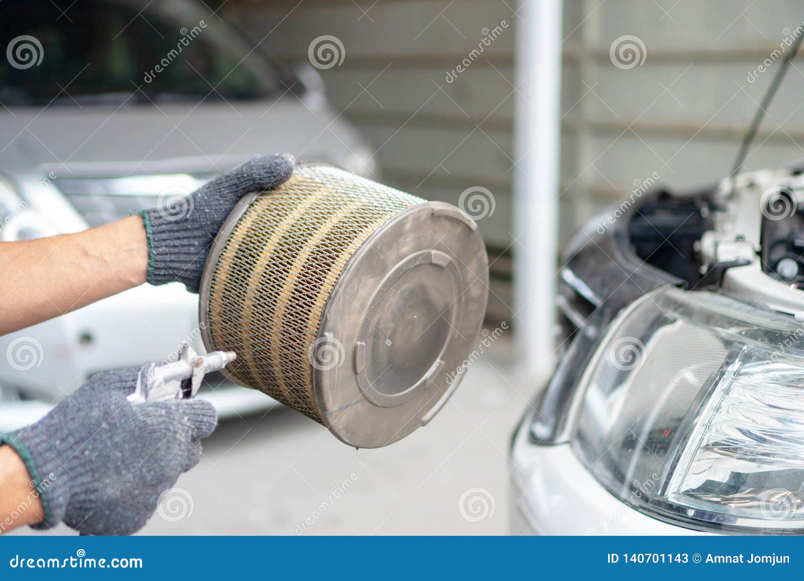 Blow the car air filter stock image. Image of profession 140701143