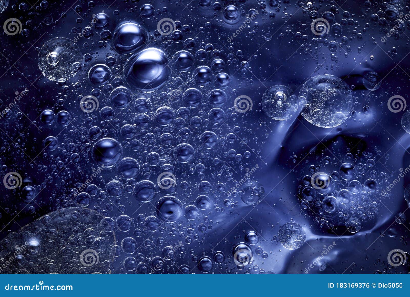 blue abstract background with agglomeration of moving bubbles