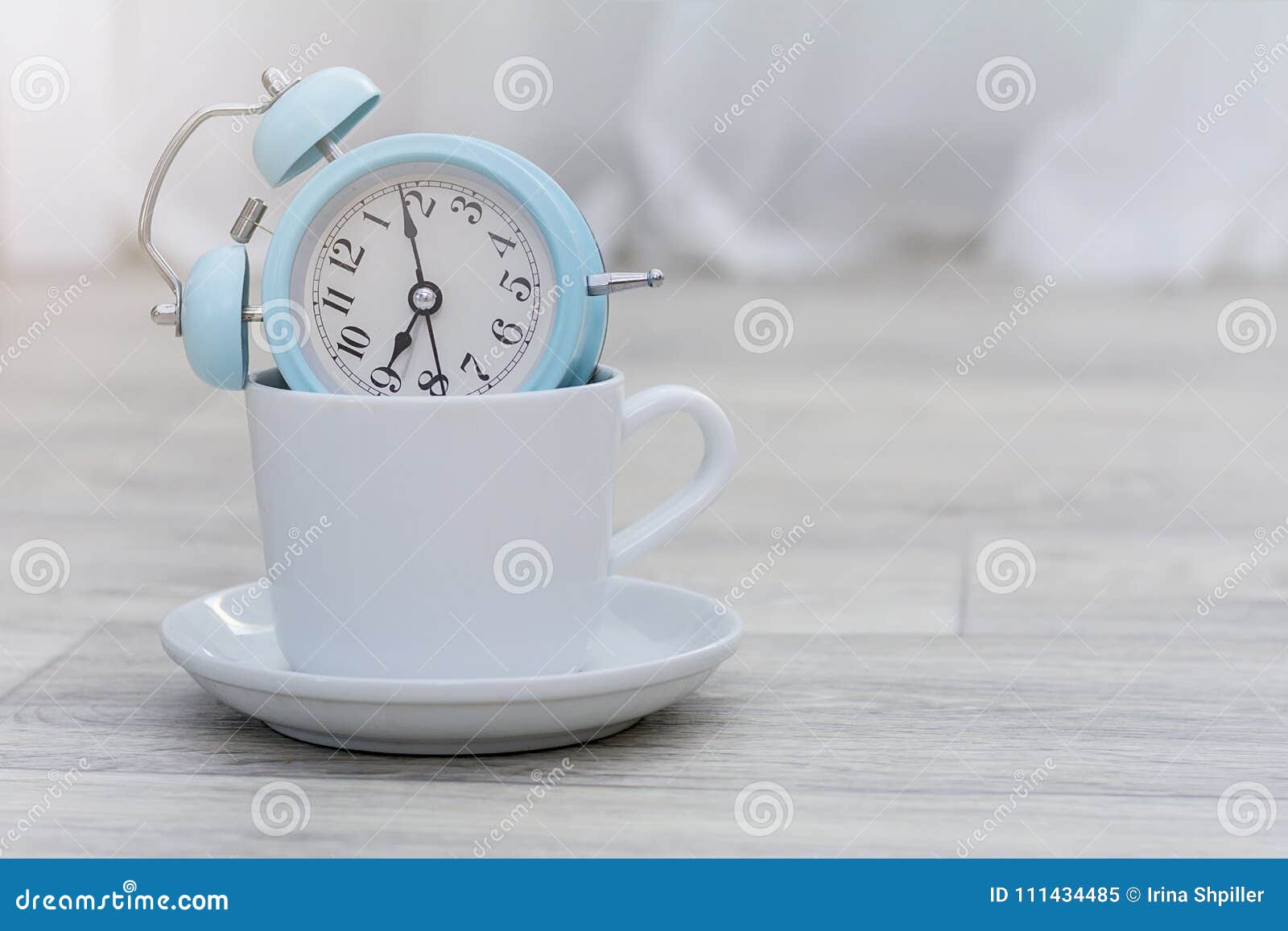 Blue Alarm Clock in Morning Light and Coffee, Morning Concept Stock