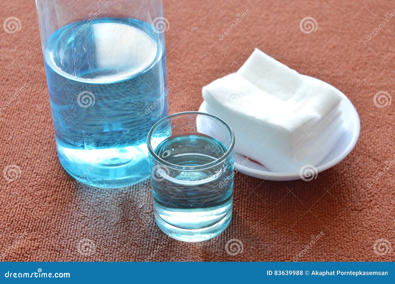 Blue Alcohol for Wash Wound in Glass and Clean White Cotton Stock Photo