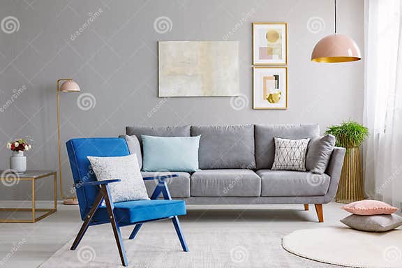 Blue Armchair Near Grey Settee in Modern Living Room Interior Wi Stock ...