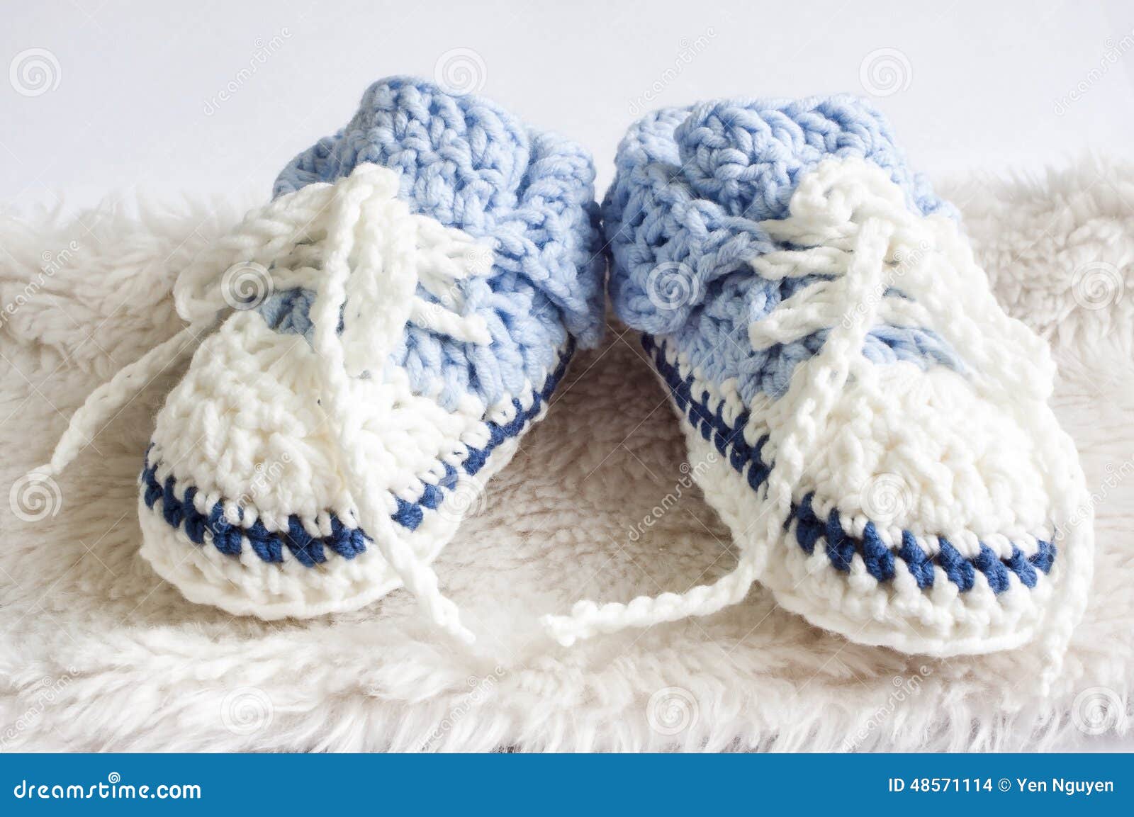 Blue baby booties stock photo. Image of cute, foot, pink 48571114