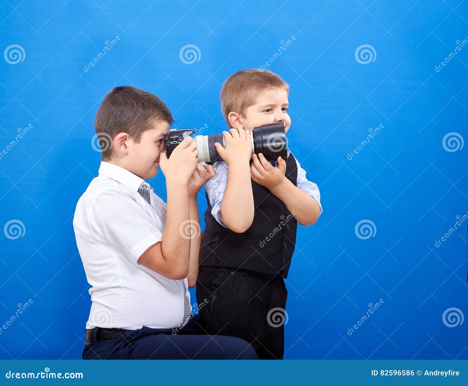 On the Blue Background Boys are Photographing Stock Photo Image of photographer, family 82596586