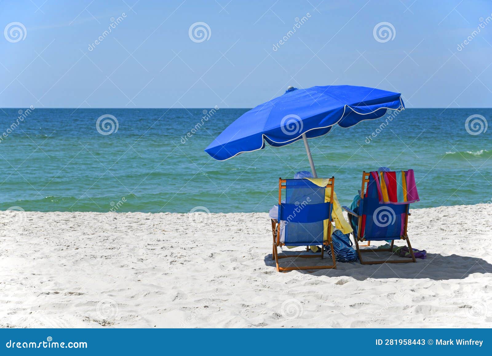 Blue Beach Chairs with Umbrella on Gulf Shores Beach Stock Image
