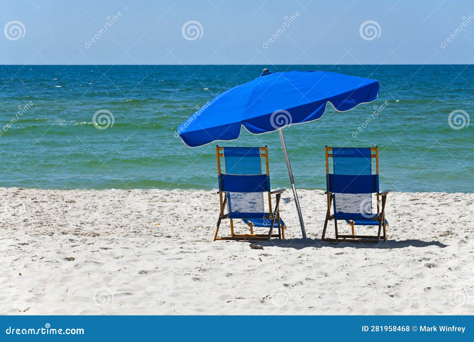 Blue Beach Chairs with Umbrella on Gulf Shores Beach Stock Photo