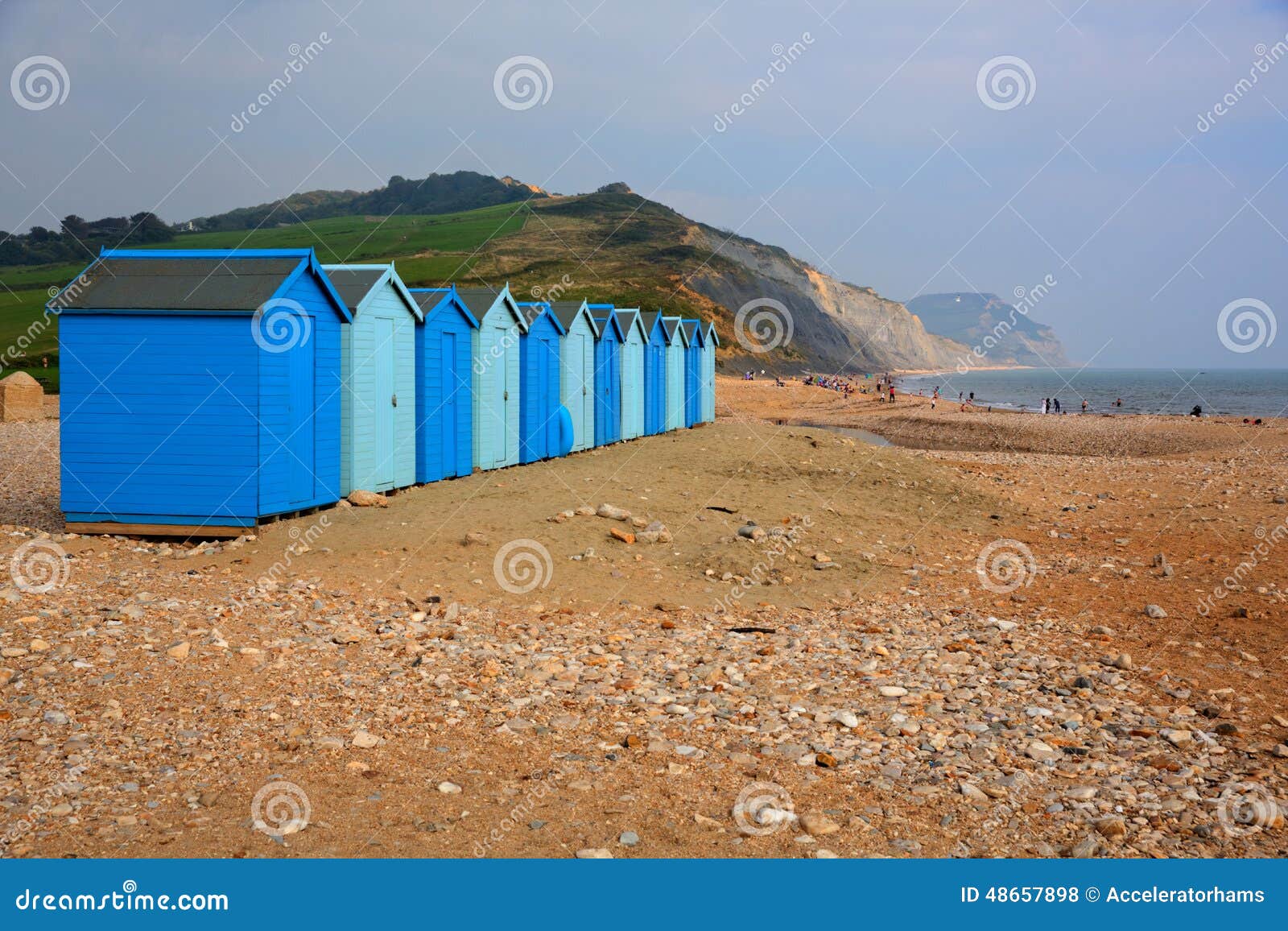 Blue beach huts Charmouth Dorset England UK. Charmouth beach and coast Dorset England UK overlooking Lyme Bay and on the South West coast path