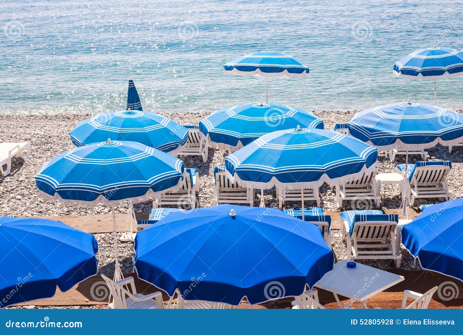 Blue Beach Umbrellas in Nice Stock Photo - Image of nice, beaches: 52805928