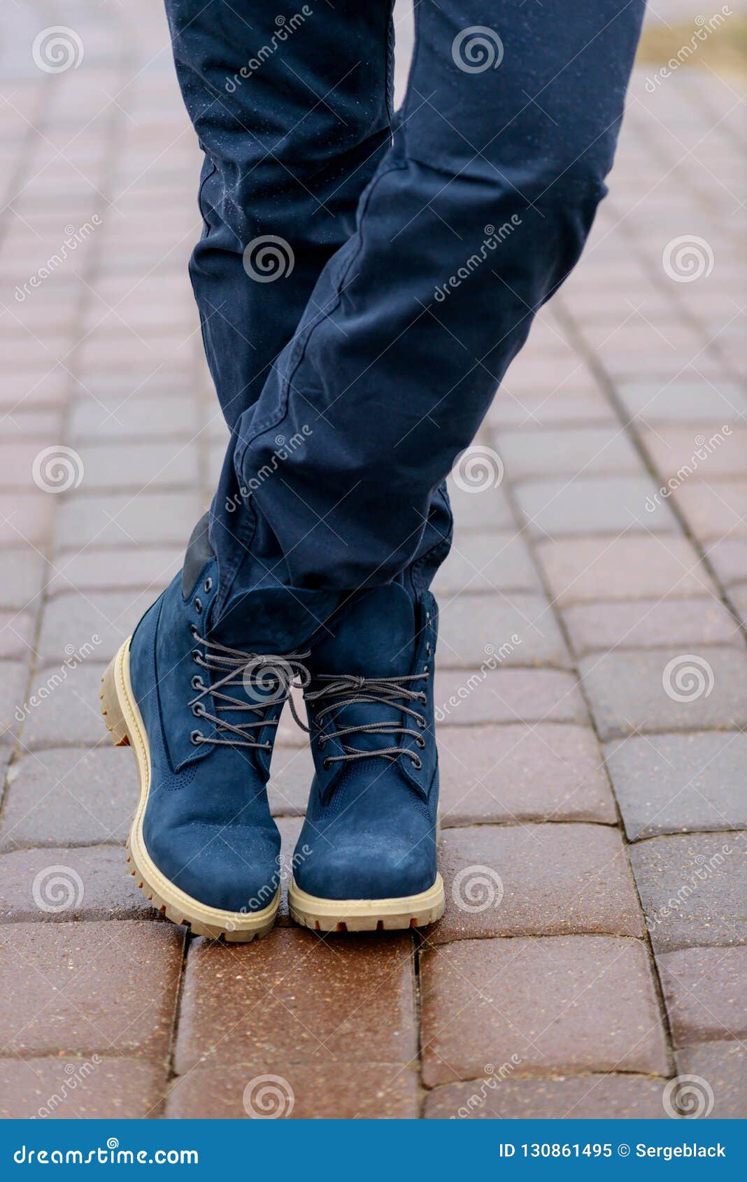 Blue Boots on Men`s Legs in Blue Jeans Stock Image - Image of boot, field:  130861495