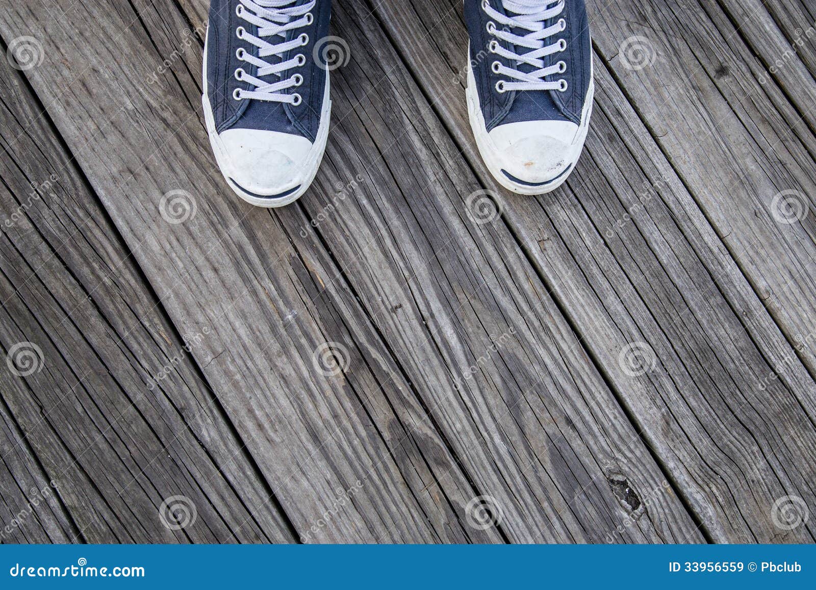 Blue Canvas Sneakers on Feet on Wood Stock Image - Image of cloth ...
