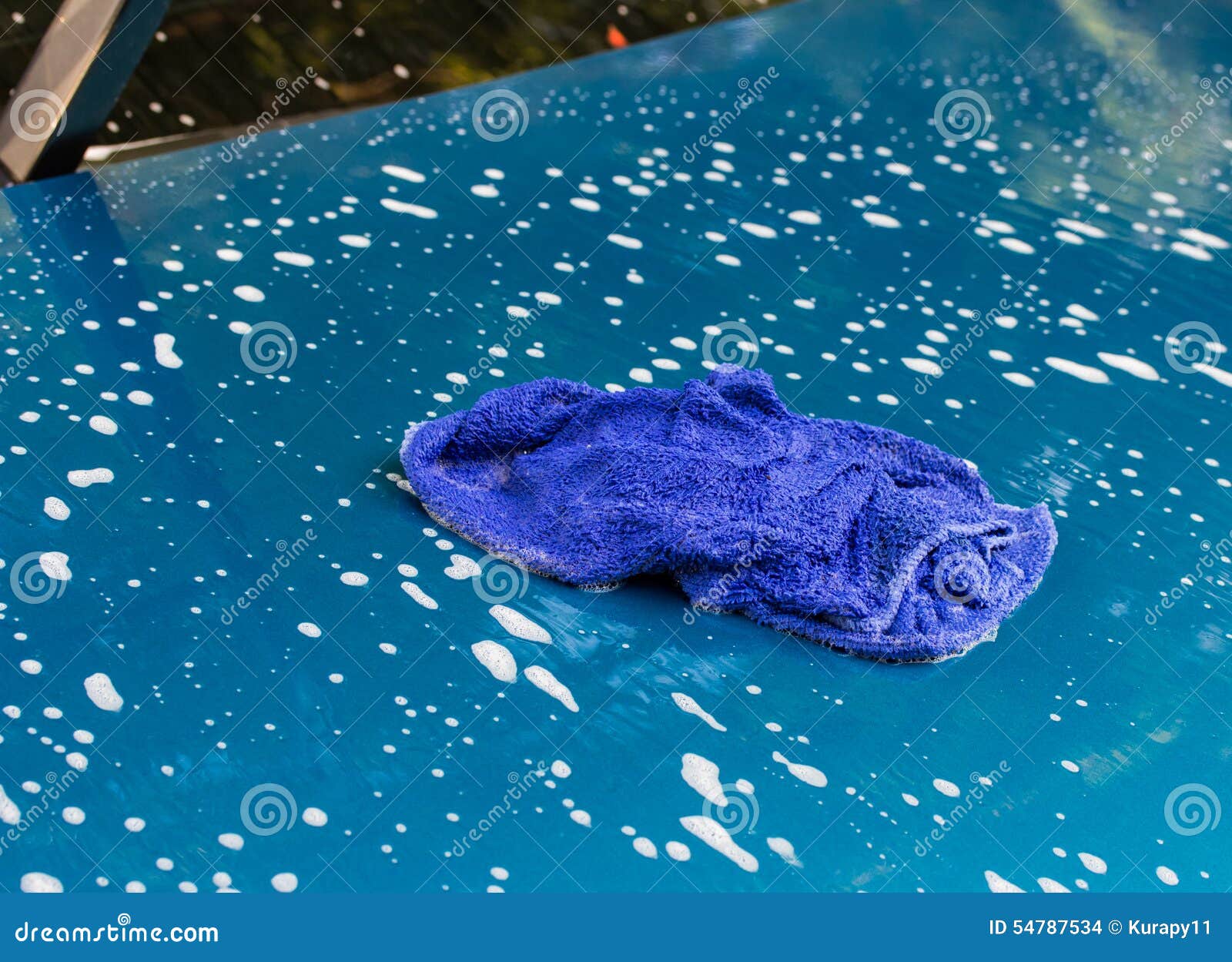 Blue Car Wash Cloths on the Hood of a Car. Stock Photo Image of