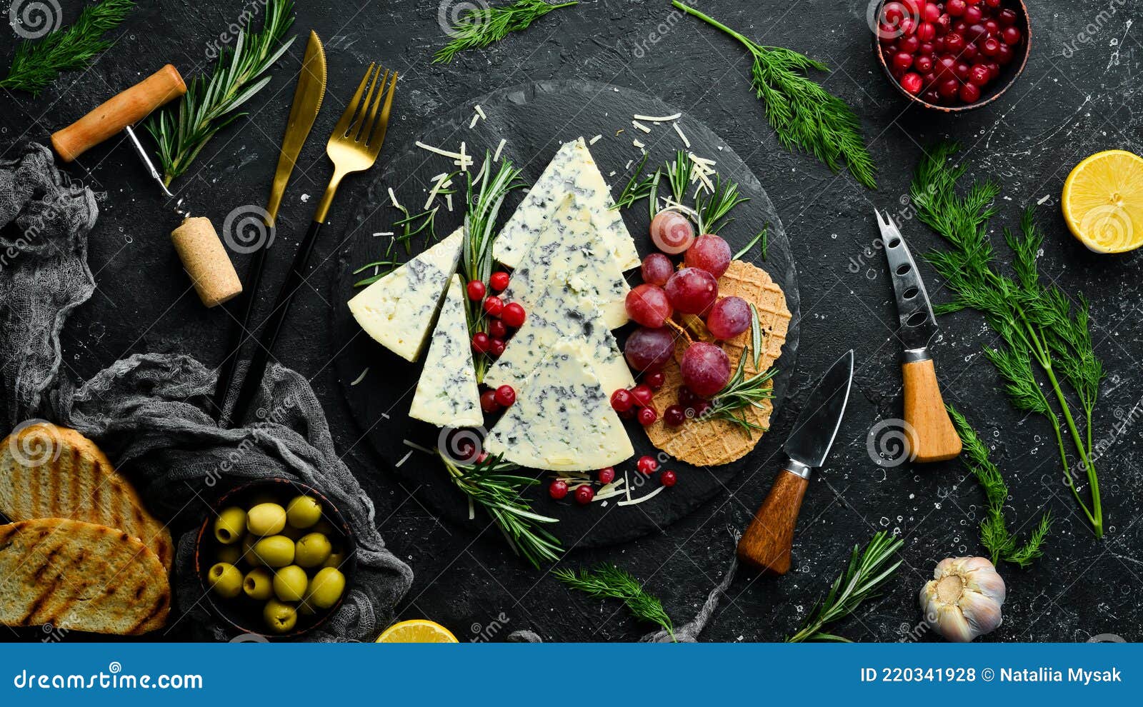 Blue Cheese with Mold on a Plate with Snacks. Rustic Style Stock Photo