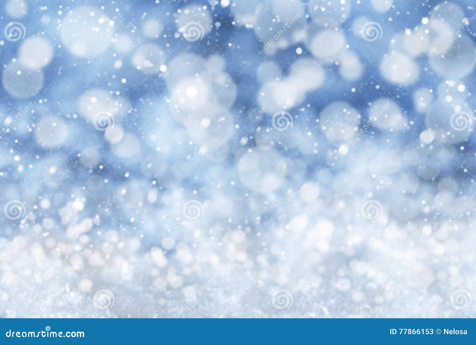 blue christmas background with snow, snwoflakes and bokeh
