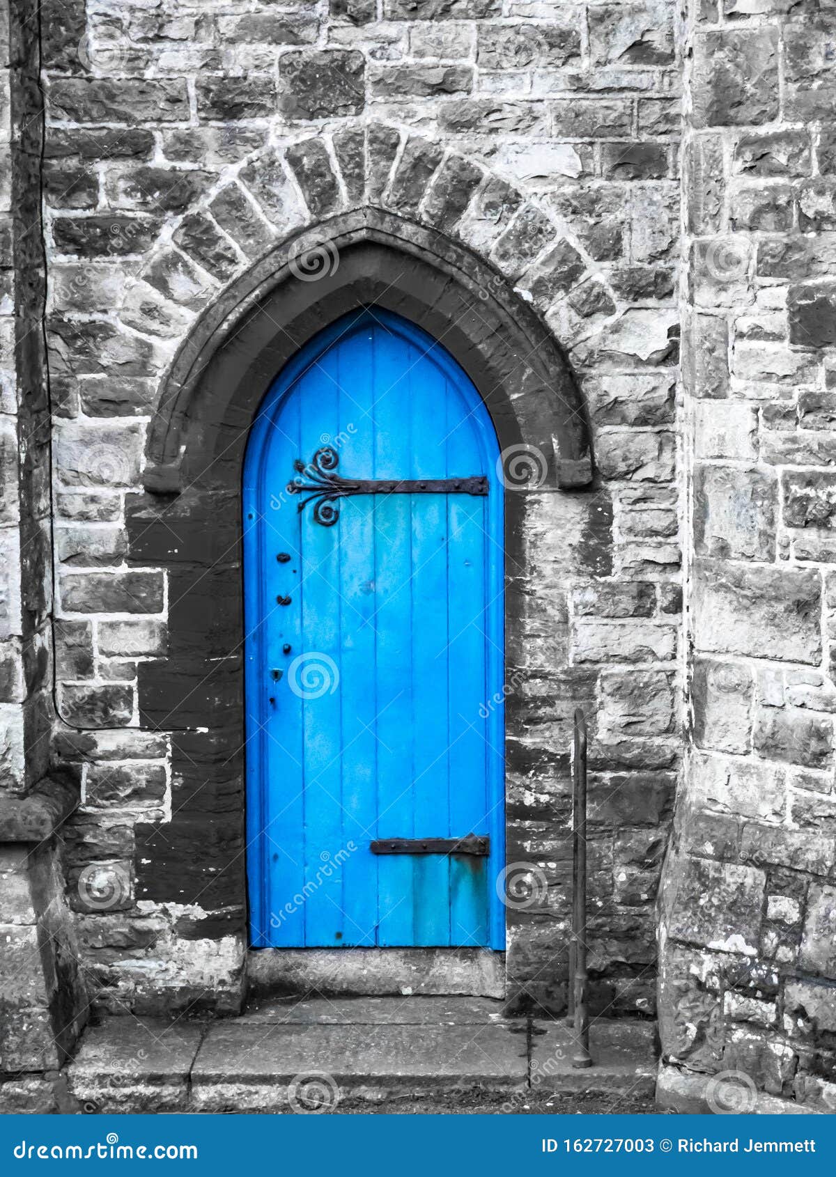 a blue church door penzance cornwall with saturated blue and grey stonework